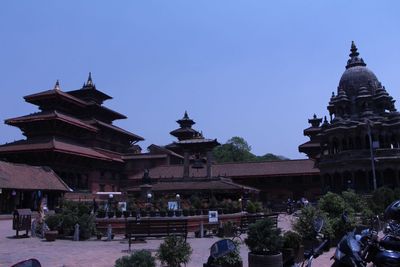 Low angle view of temple against clear blue sky