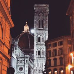 Low angle view of illuminated church at night