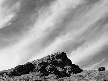 Low angle view of snowcapped mountain against sky
