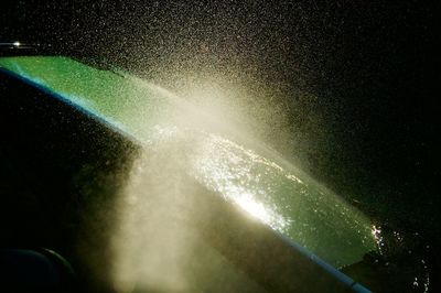 Full frame shot of wet illuminated lights at night