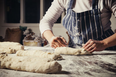 Midsection of man preparing food