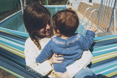 Mother and son while standing outdoors