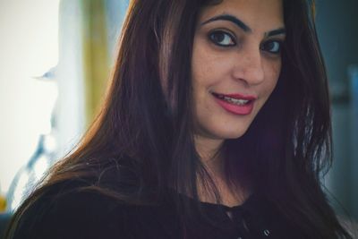 Close-up portrait of smiling woman