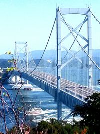 Suspension bridge against blue sky