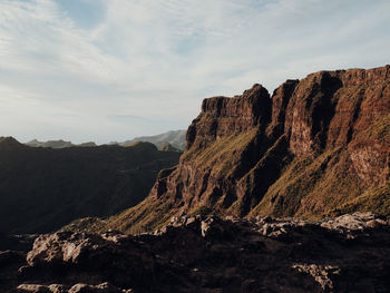 Rock formations on mountain against sky