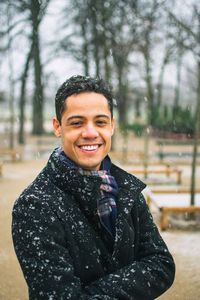 Portrait of smiling young man in winter