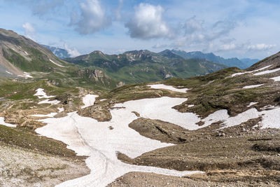 Scenic view of landscape and mountains against sky