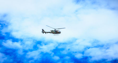 Low angle view of airplane against sky