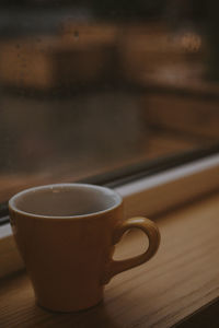 Close-up of coffee cup on table