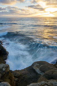 Scenic view of sea against sky during sunset