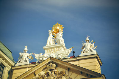 Low angle view of statue of building against sky