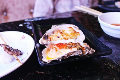 Close-up of served oysters on plate