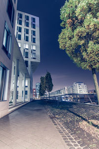 Trees and buildings against sky