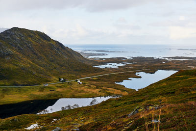 Panoramic view of landscape, sea and mountains against clear sky on moskenesoya lofoten north norway