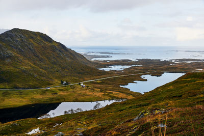 Panoramic view of a road, landscape, sea  against clear sky on moskenesoya lofoten north norway