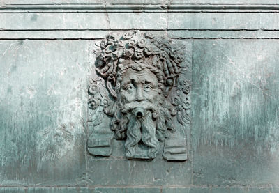 Close-up of sculpture against wall