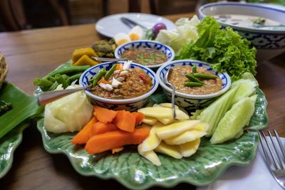 High angle view of chopped vegetables in bowl on table