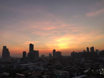 Cityscape against sky during sunset