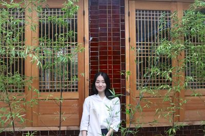 Woman looking through window