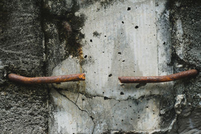 Close-up of rusty pipe on wall