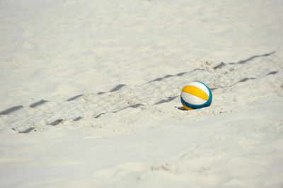 Ball on sand at beach