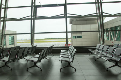 Empty chairs and tables in airport