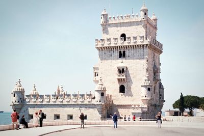 Group of people in front of historical building