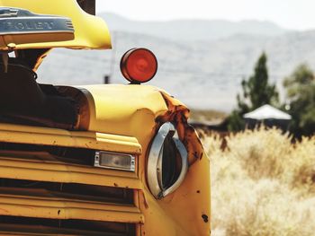 Close-up of yellow rusty car