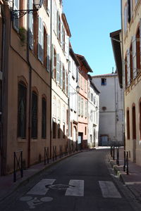 Street in city against clear sky