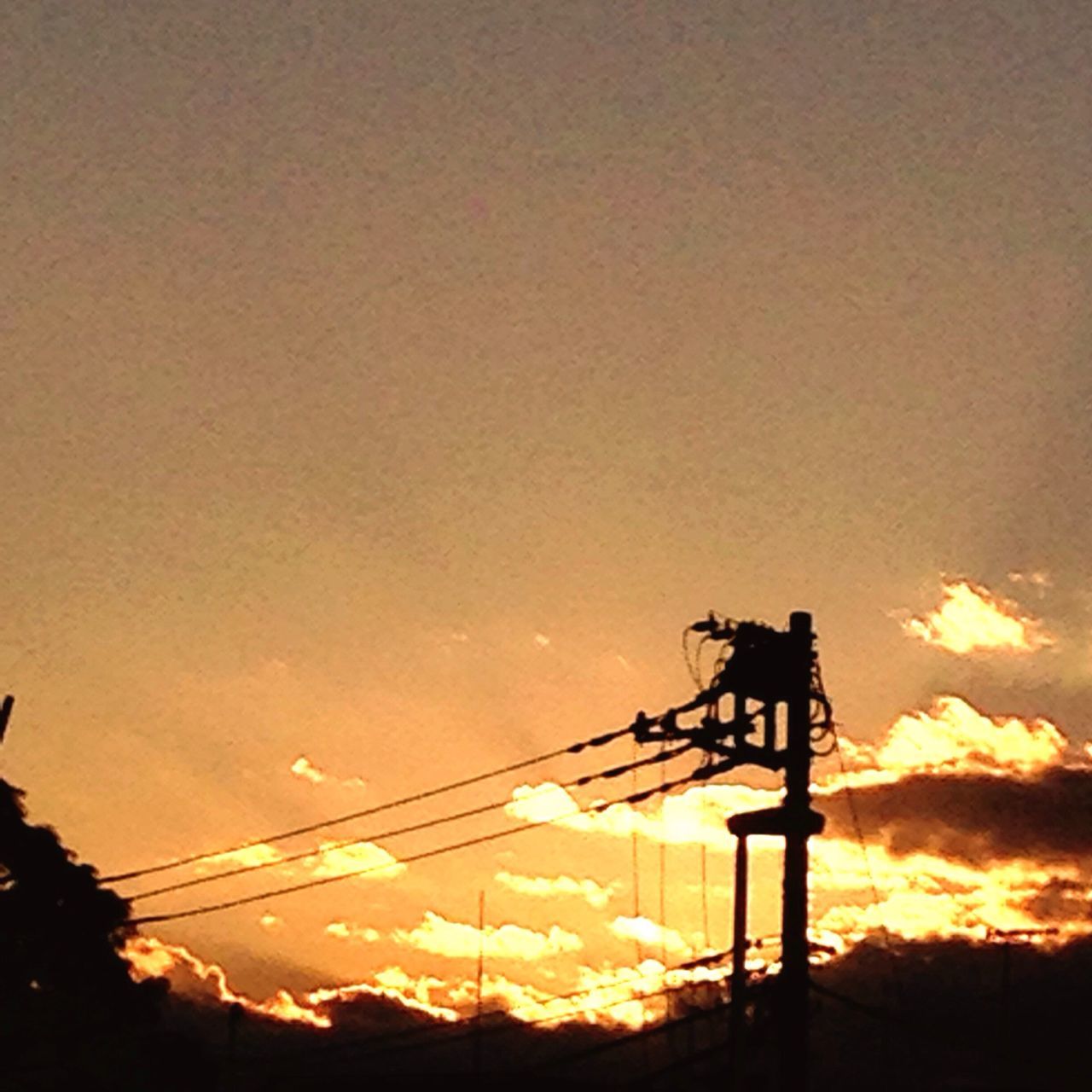sunset, silhouette, orange color, fuel and power generation, sky, sun, low angle view, electricity pylon, technology, beauty in nature, scenics, tranquility, power supply, electricity, tranquil scene, nature, power line, connection, idyllic, environmental conservation