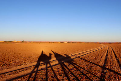 View of landscape against clear blue sky