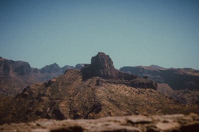 Scenic view of mountains against clear blue sky