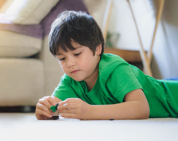 Portrait of boy on table