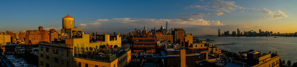 Panoramic view of buildings against sky during sunset