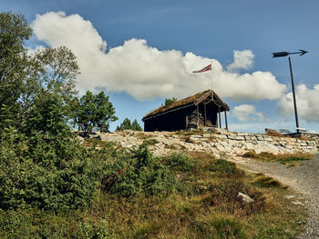 House on field against sky