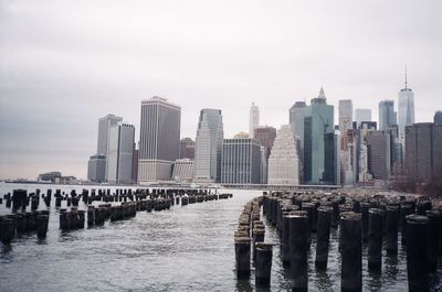 Panoramic view of sea and buildings against sky