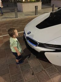 Boy playing with umbrella