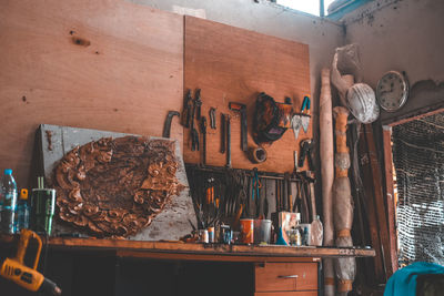 Low angle view of tools hanging on wall