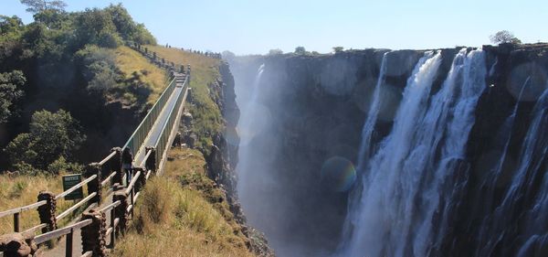 Panoramic view of waterfall against sky