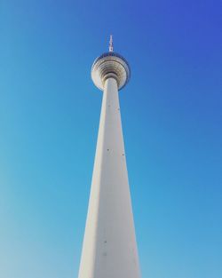 Low angle view of fernsehturm tower against clear blue sky