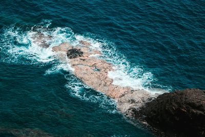 High angle view of waves in sea