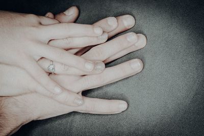 Close-up of woman hand on wall