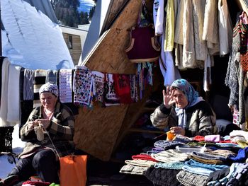 People at market stall