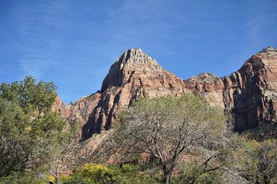 Low angle view of rock formations against sky