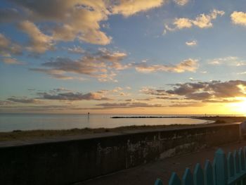 Scenic view of sea against sky at sunset