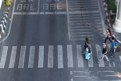 High angle view of people crossing road