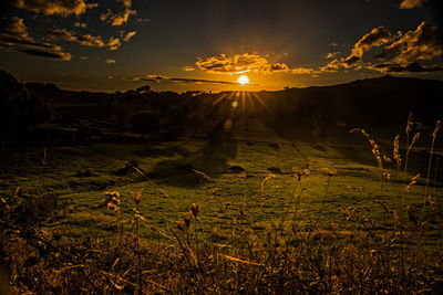 Scenic view of landscape against sky during sunset