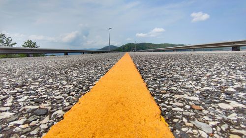 Surface level of railroad track against sky