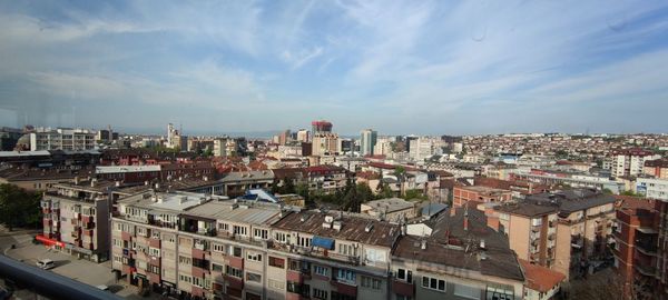 High angle view of buildings in city against sky