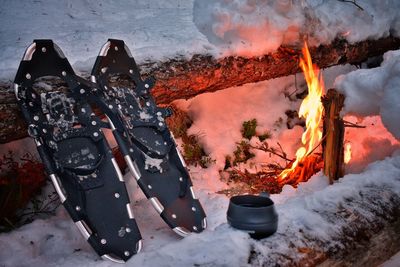 High angle view of bonfire on snow covered mountain